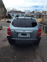 Rear view of a 2005 Hyundai Tucson in good condition parked outside.
