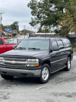 2005 Chevrolet Suburban for sale, clean condition with new tires and AC, minimal wear seats, drives well under 100k miles.