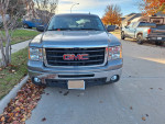 2008 GMC Sierra SLE with a VortecMax engine parked in a residential area, showcasing its front design.