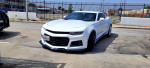 2017 Chevrolet Camaro ZL1 in white, front view, parked on street with clear skies.