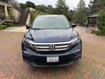 2016 Honda Pilot EXL SUV in Obsidian Blue with gray leather interior parked outdoors