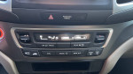 Close-up of the climate control system in a 2019 Honda Pilot showing various settings and controls