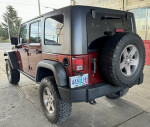 2010 Jeep Rubicon Unlimited parked, showcasing its exterior design and off-road capabilities.