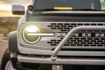 Close-up of 2022 Ford Bronco Wildtrack front grille and headlight with custom features