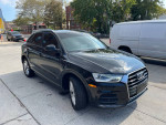 2017 Audi Q3 Premium 2.0T Quattro in excellent condition, showcasing sleek black design and smooth lines.