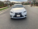 Front view of a 2014 Lexus IS 250 RWD in silver, parked on a residential street.