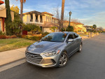 2017 Hyundai Elantra Eco FWD parked on a residential street, showcasing clean exterior and modern design.