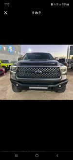 Front view of a 2018 Toyota Tundra TRD Sport 4x4 with LED lights and custom bumper.
