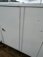 Close-up of service body doors on 2001 Chevrolet Silverado 1500, showcasing storage features and condition.