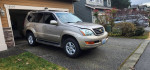 2004 Lexus GX 470 4WD in a residential driveway, showcasing its clean exterior and low mileage.