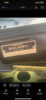 Saleen tag on a 2001 Ford Mustang, showcasing unique features and performance specifications.