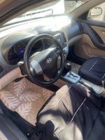 Interior view of a 2010 Hyundai Elantra, featuring automatic controls and comfortable seats.