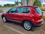 2012 Volkswagen Tiguan S 4Motion AWD in red, showcasing its well-maintained exterior and stylish design.
