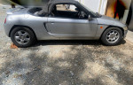 1991 Honda Beat Convertible with damaged engine, not running, parked on gravel.