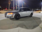 2007 Audi A4 Quattro with black rims parked at night, featuring new tires and a clean exterior.