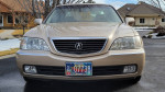 Front view of a 1999 Acura RL with low mileage, showcasing its clean condition and elegant design.