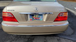 Rear view of a well-maintained 1999 Acura RL with a clean license plate and shiny tail lights.