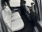 Interior view of a 2017 Ford F-150 Lariat showing clean leather seats and spacious cabin.