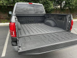 2020 Ford F-150 Lariat 4WD truck bed with a clean, well-maintained surface and rear view.