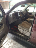 Interior view of a 2006 Chevrolet TrailBlazer with seating and dashboard details, showcasing its good condition.