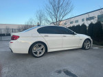 2011 BMW 535xi Xdrive sedan in white, featuring M-sport package with sleek design and premium features.