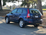 2011 Honda CR-V parked on the street, showing clean exterior and wheels