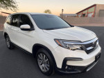 2019 Honda Pilot EX in white, a spacious SUV with 3rd row seating for 8 passengers and advanced safety features.