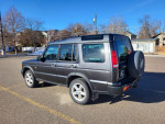 1999 Land Rover Discovery parked, displaying its rugged design and features for sale with low mileage.