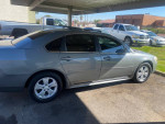 2009 Chevrolet Impala LT FWD gray sedan with low mileage parked outdoors