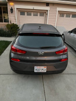 2018 Hyundai Elantra GT hatchback parked outside, featuring 17” alloy wheels and a clean exterior.