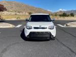 Front view of a well-maintained 2014 Kia Soul with 147,000 miles parked in a scenic area.