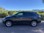 2009 Lexus RX 350 SUV with clean title and excellent condition, parked against a scenic background.