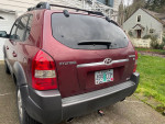 2005 Hyundai Tucson mini SUV with V6 engine, 4WD, and rear hatch, parked outdoors
