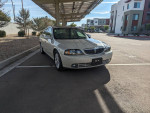 2004 Lincoln LS sedan in excellent condition, showcasing low mileage and fully loaded features.