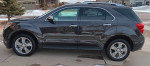 2015 Chevrolet Equinox LTZ SUV in gray parked on driveway, featuring modern design and shiny alloy wheels.