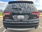 Rear view of a 2019 Honda Pilot EX-L AWD SUV with low mileage for sale.