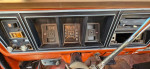 Interior dashboard view of a classic 1976 Ford F250 4X4 with gauges and controls.
