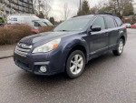 2013 Subaru Outback Premium Wagon AWD with heated seats, clean title, and one owner, parked on the street.