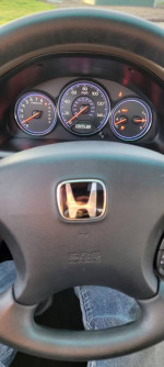 Dashboard view of a 2004 Honda Civic EX displaying mileage and instrument panel