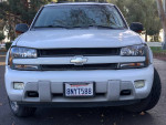 Front view of a Chevrolet TrailBlazer, 80,000 miles, seating for seven passengers, clean exterior and functional interior.
