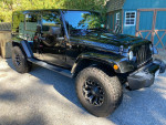 2017 Jeep Wrangler Unlimited Smoky Mountain Edition, black exterior, off-road tires, parked on gravel