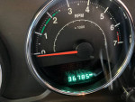 Close-up of the speedometer in a 2017 Jeep Wrangler Unlimited showing 36,785 miles driven.