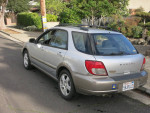 2003 Subaru Impreza Outback Sport Wagon in silver, showcasing AWD features and garage-kept condition.