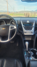 Interior view of a well-maintained 2011 Chevrolet Equinox with leather seats and modern dashboard features.