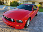 2007 red Ford Mustang GT convertible with 67k miles, featuring a power top and leather seats.