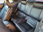 Interior view of a well-maintained 2007 Ford Mustang GT with black leather seats