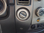 Close-up of Nissan Titan 4x4 control knobs with automatic transmission features.