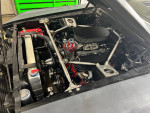 Engine bay of a 1970 Ford Mustang Coupe, featuring a fuel-injected 302 and upgraded components.