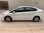 Side view of a 2011 Toyota Prius, a reliable hybrid car with excellent gas mileage and modern features.