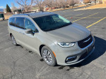2021 Chrysler Pacifica Hybrid Limited in grey, parked with a clean exterior, showcasing family-friendly features.